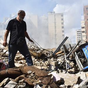 The destruction at the site of an overnight Israeli airstrike on the Laylaki, Harat Hreik, and Sant Tares neighborhoods in Beirut's southern suburbs on October 1, 2024