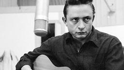 Johnny Cash mit Gitarre bei Studioaufnahmen